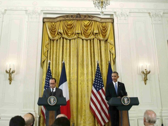 U.S. President Barack Obama (R) and French President Francois Hollande hold a joint news conference in the East Room of the White House in Washington November 24, 2015. REUTERS/Carlos Barria