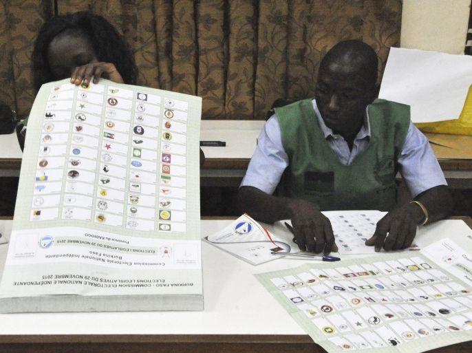 Electoral officals ready themselves with ballot papers for the general elections in Ouagadougou, Burkina Faso, 29 November 2015. Polls opened in Burkina Faso's presidential and parliamentary election on 29 November, with expectations high one year after a violent public uprising forced the long-time president out of office. It is the first election in the country after president Blaise Compaore was forced from office last year which sparked a year of political uncertainty. Thousands are expected to vote to elect a new president and parliament with Roch Marc Christian Kabore and Zephirin Diabre seen as strongest contenders for president. EPA/AHMED YEMPABOU BEST QUALITY AVAILABLE