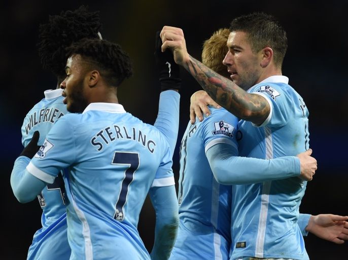 7306 - Manchester, Greater Manchester, UNITED KINGDOM : Manchester City's Serbian defender Aleksandar Kolarov (R) celebrates with Manchester City's Belgian midfielder Kevin De Bruyne and Manchester City's English midfielder Raheem Sterling after scoring during the English Premier League football match between Manchester City and Southampton at The Etihad stadium in Manchester, north west England on November 28, 2015. AFP PHOTO / PAUL ELLIS