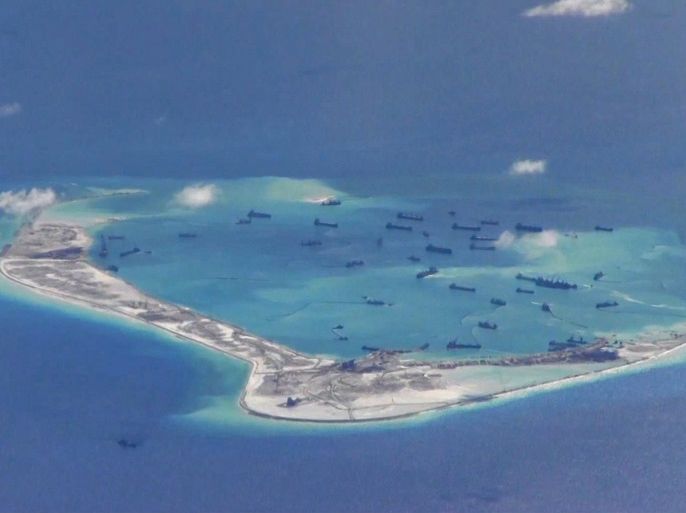 Chinese dredging vessels are purportedly seen in the waters around Mischief Reef in the disputed Spratly Islands in the South China Sea in this still image from video taken by a P-8A Poseidon surveillance aircraft provided by the United States Navy May 21, 2015. U.S. Navy/Handout via Reuters/File Photo ATTENTION EDITORS - THIS PICTURE WAS PROVIDED BY A THIRD PARTY. REUTERS IS UNABLE TO INDEPENDENTLY VERIFY THE AUTHENTICITY, CONTENT, LOCATION OR DATE OF THIS IMAGE. THI