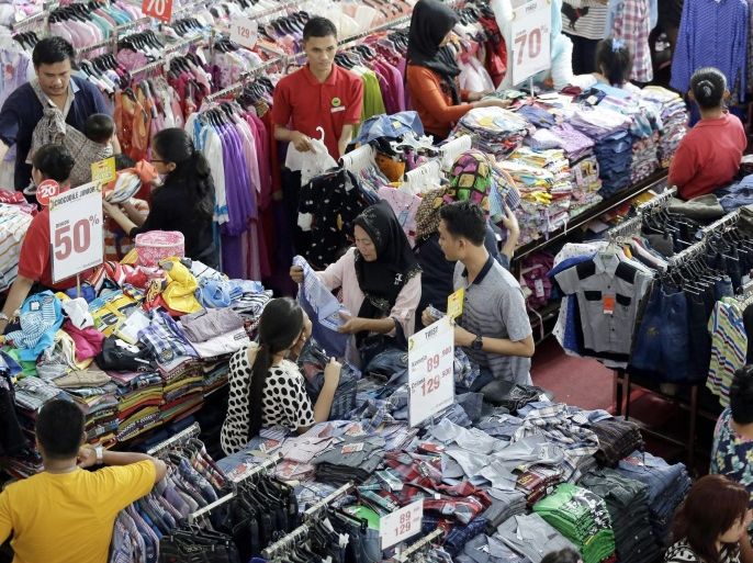 Customers look for new dress at a shoping mall in Medan, North Sumatra, Indonesia, 29 June 2016. Indonesian Muslim residents began to flock shopping malls and supermarket for shopping purposes especially the week before Eid holiday. Muslims around the world celebrate the holy month of Ramadan by praying during the night time and abstaining from eating and drinking during the period between sunrise and sunset. Ramadan is the ninth month in the Islamic calendar and it is