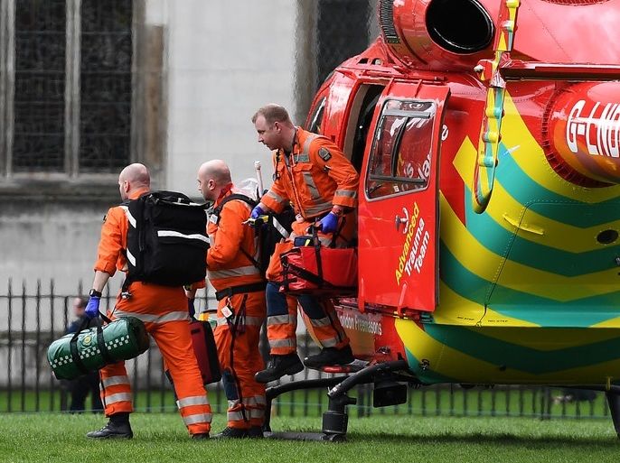 epa05863961 An air ambulance on Parliament Square following a major incident outside the Houses of Parliament in central London, Britain 22 March 2017. Scotland Yard said on 22 March 21017 the police were called to a firearms incident in the Westminister palace grounds and on Westminster Bridge amid reports of at least two people killed and several other people injured in central London. EPA/ANDY RAIN