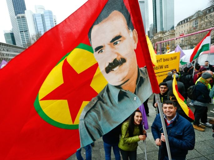 People carry a flag with the picture of imprisoned Kurdish rebel leader Abdullah Ocalan during a demonstration organised by Kurds, in Frankfurt, Germany, March 18, 2017. REUTERS/Ralph Orlowski