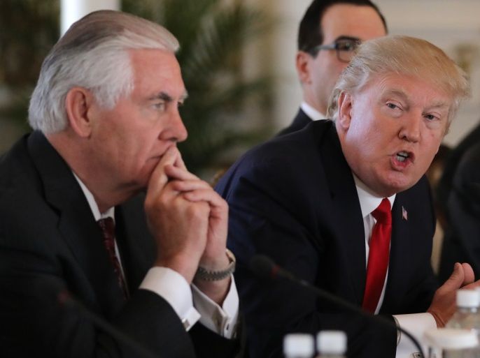U.S. President Donald Trump (R) speaks next to Secretary of State Rex Tillerson during a bilateral meeting with China's President Xi Jinping (Not Pictured) at Trump's Mar-a-Lago estate in Palm Beach, Florida, U.S., April 7, 2017.