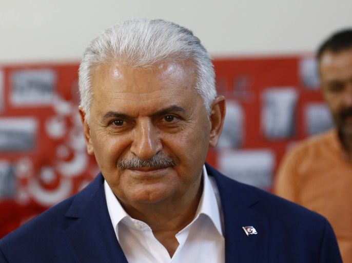 Turkish Prime Minister Binali Yildirim looks on at a polling station during a referendum in the Aegean port city of Izmir, Turkey, April 16, 2017. REUTERS/Osman Orsal