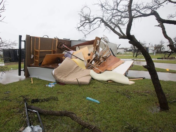 A mobile home lies split open in the Paradise Lagoons RV Resort on August 26, 2017 in Aransas Pass, TX following passage of Hurricane Harvey. / AFP PHOTO / Daniel KRAMER (Photo credit should read DANIEL KRAMER/AFP/Getty Images)