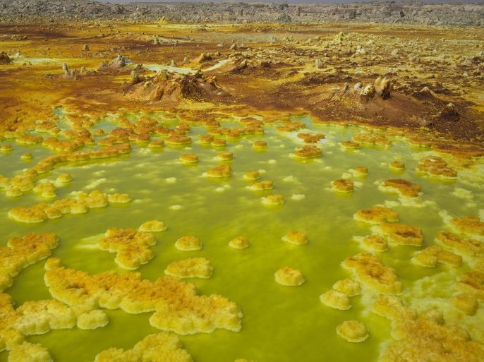 Sulphur and mineral salt formations are seen near Dallol in the Danakil Depression, northern Ethiopia April 22, 2013. The Danakil Depression in Ethiopia is one of the hottest and harshest environments on earth, with an average annual temperature of 94 degrees Fahrenheit (34.4 Celsius). For centuries, merchants have travelled there with caravans of camels to collect salt from the surface of the vast desert basin. The mineral is extracted and shaped into slabs, then loaded onto the animals before being transported back across the desert so that it can be sold around the country. Picture taken April 22, 2013. REUTERS/Siegfried Modola (ETHIOPIA - Tags: BUSINESS SOCIETY) ATTENTION EDITORS: PICTURE 1 OF 30 FOR PACKAGE 'ETHIOPIA'S ANCIENT SALT TRAIL'SEARCH 'DANAKIL DEPRESSION' FOR ALL IMAGES FOR BEST QUALITY IMAGE ALSO SEE: GF2EA530VDQ01