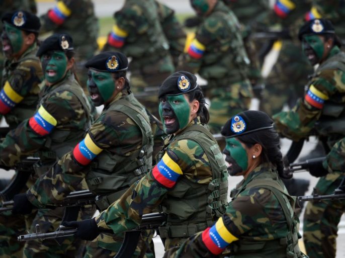 Venezuelan army female commandos participate in a military parade to celebrate Venezuela's 206th anniversary of its Independence in Caracas on July 5, 2017. Dozens of pro-government activists stormed into the seat of Venezuela's National Assembly Wednesday as the opposition-controlled legislature was holding a special session to mark the independence day. / AFP PHOTO / FEDERICO PARRA (Photo credit should read FEDERICO PARRA/AFP/Getty Images)