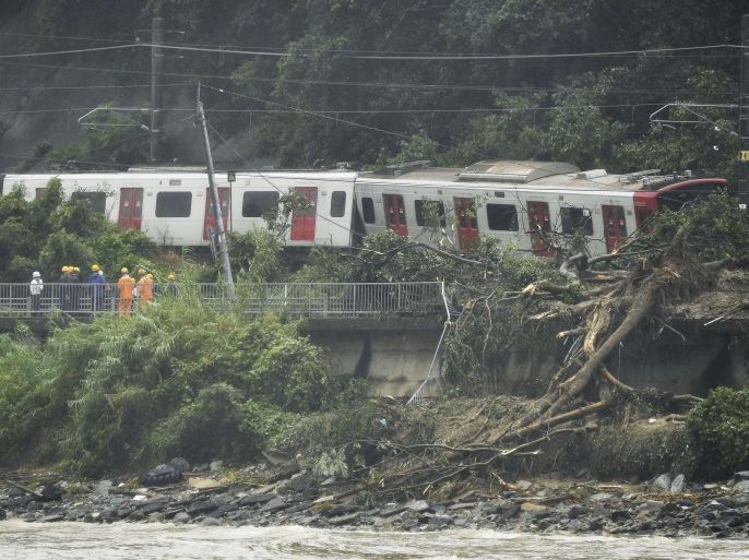 Derailed train caused by a landslide following heavy rain is seen in Karastu, southwestern Japan, in this photo taken by Kyodo July 7, 2018. Mandatory credit Kyodo/via REUTERS ATTENTION EDITORS - THIS IMAGE WAS PROVIDED BY A THIRD PARTY. MANDATORY CREDIT. JAPAN OUT. NO COMMERCIAL OR EDITORIAL SALES IN JAPAN.