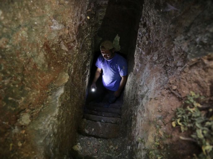 Ahmed Abdulkarim al-Shahad is seen at a makeshift shelter in an underground cave in Idlib, Syria September 3, 2018. Picture taken September 3, 2018. REUTERS/Khalil Ashawi