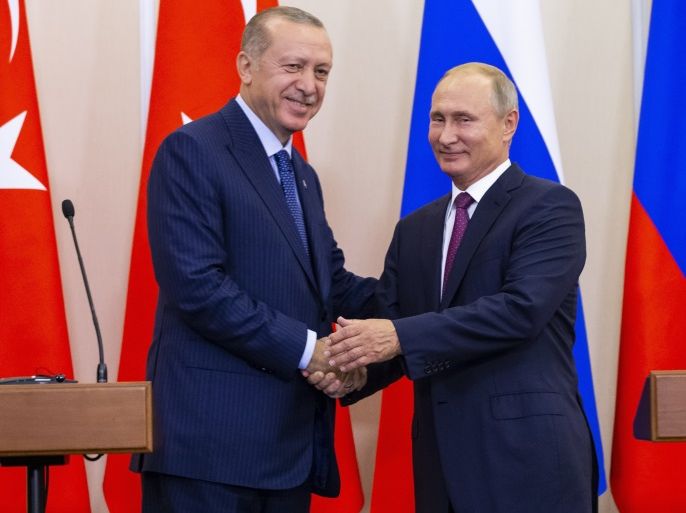 Russian President Vladimir Putin (R) and his Turkish counterpart Tayyip Erdogan shake hands during a news conference following their talks in Sochi, Russia September 17, 2018. Alexander Zemlianichenko/Pool via REUTERS
