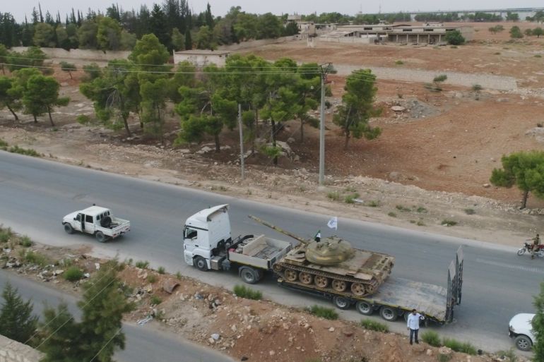 Withdrawal process of heavy weapons in Idlib- - IDLIB, SYRIA - OCTOBER 08: A drone photo shows Syrian opposition forces as armoured vehicles and heavy weapons of opposition forces are being withdrawn from Syria's Idlib to complete the establishment of the disarmament field due to the Sochi Agreement, agreed by Turkey and Russia, on October 08, 2018.