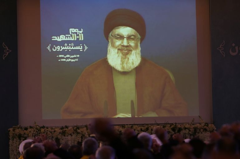 Lebanon's Hezbollah leader Sayyed Hassan Nasrallah addresses his supporters via a screen in Nabatiyeh, Lebanon, November 10, 2018. REUTERS/Aziz Taher