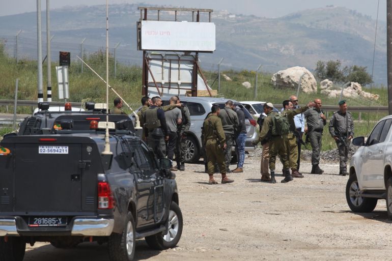 Palestinian killed by Israeli army fire in W. Bank- - NABLUS, WEST BANK - APRIL 20 : Israeli soldiers inspect the site where an alleged Palestinian knife attacker was shot and killed by Israeli security forces, near Nablus in the northern West Bank, on April 20, 2019.