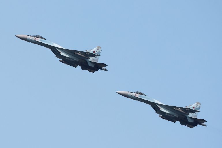 Russian Sukhoi Su-35 jet fighters perform a flight during the Aviadarts competition outside Ryazan
