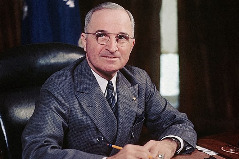(Original Caption) 4/1946: President Harry S. Truman seated at his desk holding a pencil.