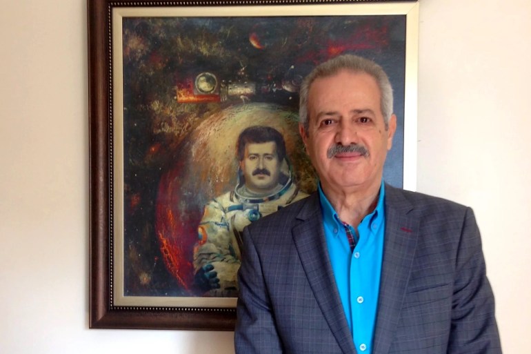 Syria's Mohammed Faris was a national hero after he became the country's first cosmonaut in 1987, traveling to the Soviet Union's Mir Space Station. Now he's a refugee in Istanbul, Turkey. Faris, 65, is shown standing in front of a painting of himself as a cosmonaut. A critic of Syria's President Bashar Assad, he still hopes to return to his homeland. crdfit : Peter Kenyon / NPR return to his homeland.