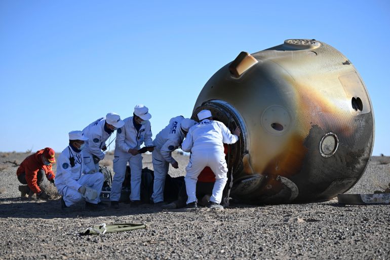 In this photo released by Xinhua News Agency, workers open up the capsule of the Shenzhou-17 manned spaceship after it lands successfully at the Dongfeng landing site in north China's Inner Mongolia Autonomous Region, Tuesday, April 30, 2024. China's Shenzhou-17 spacecraft returned to Earth Tuesday, carrying three astronauts who have completed a six-month mission aboard the country's orbiting space station. Credit: Lian Zhen/Xinhua via AP