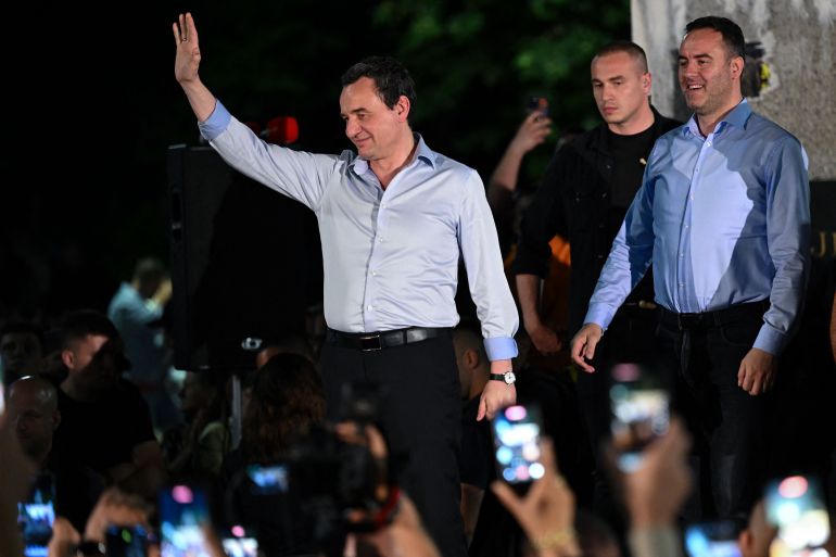 Kosovo's acting Prime Minister and leader of the Vetevendosje Movement (LVV), Albin Kurti, waves on stage as he celebrates election results with his supporters in Pristina on June 7, 2026.