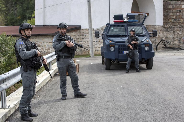 Kosovo police officers guard the exterior of the Banjska Monastery on Wednesday, Sept. 27, 2023, in the village of Banjska, Kosovo. (AP Photo/Visar Kryeziu)