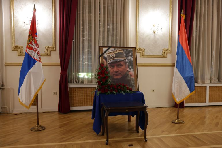 epa13213756 A portrait of former Bosnian Serb general Ratko Mladic is seen during a commemoration held in his memory in Belgrade, Serbia, 05 September 2026. Former Bosnian Serb general Ratko Mladic, who was convicted of war crimes by the International Criminal Tribunal for the Former Yugoslavia (ICTY) in 2017, died on 27 August 2026 at the age of 84. EPA/ANDREJ CUKIC
