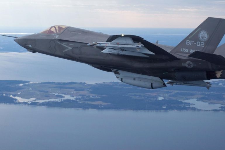 The U.S. Marine Corps version of Lockheed Martin's F35 Joint Strike Fighter, F-35B test aircraft BF-2 flies with external weapons for the first time over the Atlantic test range at Patuxent River Naval Air Systems Command in Maryland in a February 22, 2012 file photo. South Korea will not conduct maintenance of its new fleet of Lockheed Martin Corp F-35 fighters in Japan, a South Korean official said on December 18, 2014, despite a new deal by the Pentagon to service the stealth jets in Asia. REUTERS/Lockheed Martin/Handout  (UNITED STATES - Tags: TRANSPORT MILITARY POLITICS) FOR EDITORIAL USE ONLY. NOT FOR SALE FOR MARKETING OR ADVERTISING CAMPAIGNS - RTR31UJE