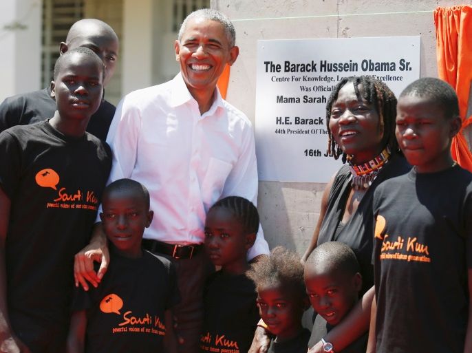 Former U.S. President Barack Obama and his sister Auma Obama pose for a photograph with children at the launch of Sauti Kuu resource centre near his ancestral home in Nyangoma Kogelo village in Siaya county, Kenya July 16, 2018. REUTERS/Thomas Mukoya