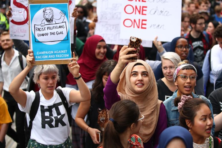 MELBOURNE, AUSTRALIA - MARCH 19: Protesters hold placards aloft as they march during the Stand Against Racism and Islamophobia: Fraser Anning Resign! rally on March 19, 2019 in Melbourne, Australia. The protesters are calling for the resignation of Senator Fraser Anning, following the statement he issued within hours of the Christchurch terror attacks on Friday 15 March, linking the shootings at two mosques to immigration. Those attacks killed 50 people and have left dozens more injured. The accused attacker, 28-year-old Australian, Brenton Tarrant, has been charged with murder and remanded in custody until April 5. The attack is the worst mass shooting in New Zealand's history. (Photo by Scott Barbour/Getty Images)