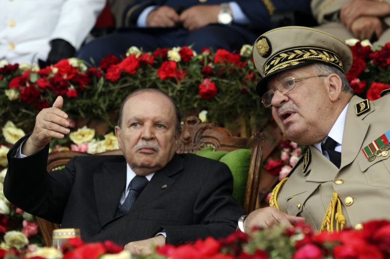 Algeria's President and head of the Armed Forces Abdelaziz Bouteflika (L) gestures while talking with Army Chief of Staff General Ahmed Gaid Salah during a graduation ceremony of the 40th class of the trainee army officers at a Military Academy in Cherchell 90 km west of Algiers June 27, 2012. REUTERS/Ramzi Boudina (ALGERIA - Tags: MILITARY POLITICS)