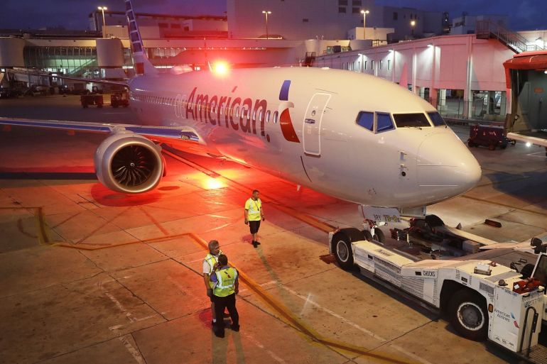 MIAMI, FL - MARCH 13: A grounded American Airlines Boeing 737 Max 8 is towed to another location at Miami International Airport on March 13, 2019 in Miami, Florida. American Airlines is reported to say that it will ground its fleet of 24 Boeing 737 Max planes and it plans to rebook passengers after the Federal Aviation Administration grounded the entire United States Boeing 737 Max fleet. Joe Raedle/Getty Images/AFP== FOR NEWSPAPERS, INTERNET, TELCOS & TELEVISION USE