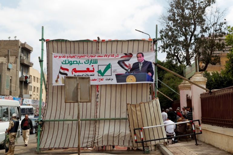 A banner depicting Egyptian President Abdel Fattah al-Sisi is seen outside a polling station, during the referendum on draft constitutional amendments, in Cairo, Egypt April 20, 2019. REUTERS/Amr Abdallah Dalsh