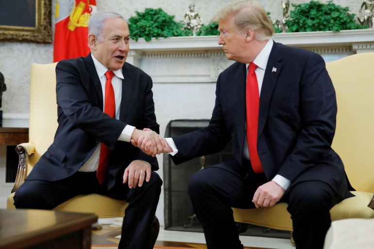 Israel's Prime Minister Benjamin Netanyahu shakes hands with U.S. President Donald Trump during their meeting in the Oval Office at the White House in Washington, U.S., March 25, 2019. REUTERS/Carlos Barria