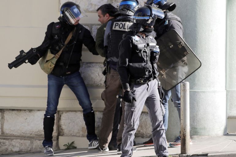 Riot police officers detain a demonstrator during 19th round of "yellow vests" protests in Nice, France, March 23, 2019. REUTERS/Eric Gaillard