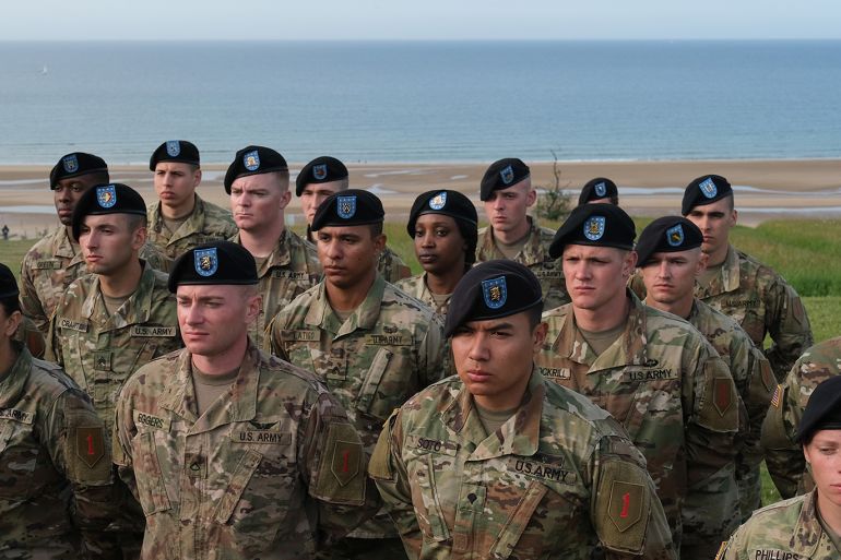 COLLEVILLE-SUR-MER, FRANCE - JUNE 03: Members of the U.S. ist Infantry Brigade attend a ceremony at the U.S. 1st Infantry Division memorial to commemorate the sacrifices of the 1st Infantry in the World War II Allied D-Day invasion on June 03, 2019 in Colleville-sur-Mer, France. Among those attending the ceremony was Charles Shay, a U.S. 1st Infantry Division veteran and a Penobscot Native American nation elder, who served as a medic and was in the first wave of soldiers that landed at Omaha, where the 1st Infantry Division sustained terrible losses when it encountered dug-in German resistance. Veterans, families, visitors and military personnel are gathering in Normandy to commemorate the 75th anniversary of the invasion, which heralded the Allied advance towards Germany and victory about 11 months later. Shay went on to serve in other World War II battles including the Battle of the Bulge. (Photo by Sean Gallup/Getty Images)
