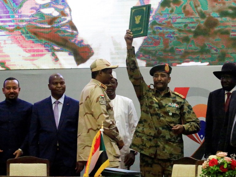 Sudan's Head of Transitional Military Council, Lieutenant General Abdel Fattah Al-Burhan, celebrates the signing of the power sharing deal, that paves the way for a transitional government, and eventual elections, following the overthrow of long-time leader Omar al-Bashir, in Khartoum, Sudan, August 17, 2019. REUTERS/Mohamed Nureldin Abdallah