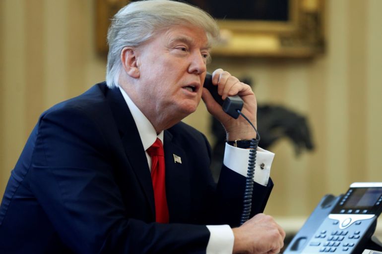 U.S. President Donald Trump speaks by phone with the Saudi Arabia's King Salman in the Oval Office at the White House in Washington, U.S. January 29, 2017. REUTERS/Jonathan Ernst