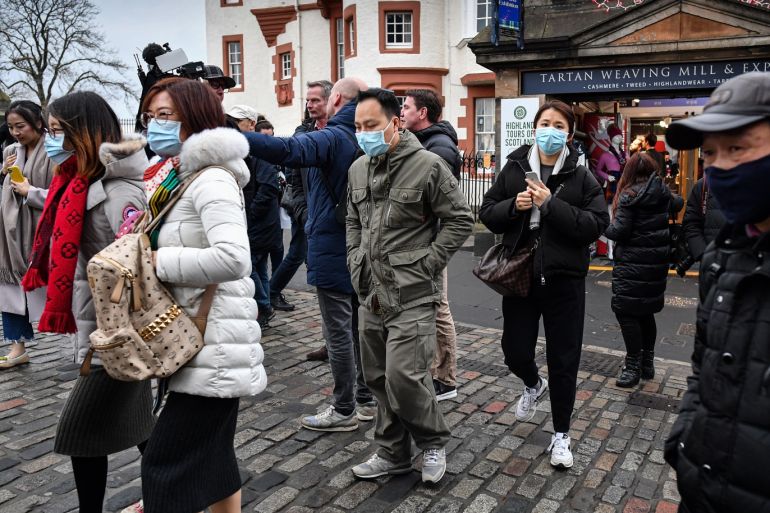 EDINBURGH, SCOTLAND - JANUARY 24: Tourists wear face masks as they visit Edinburgh Castle on January 24, 2020 in Edinburgh, Scotland. It has been confirmed that 14 people in Scotland with symptoms have tested negative for the coronavirus, which has killed at least 26 people in China. A daily incident management team has been created by the Scottish government to monitor the developing situation. (Photo by Jeff J Mitchell/Getty Images)