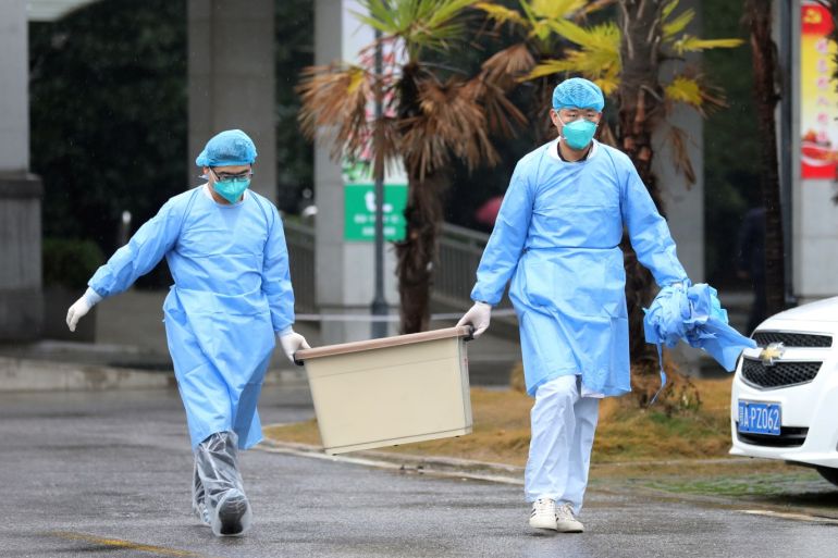 Medical staff carry a box as they walk at the Jinyintan hospital, where the patients with pneumonia caused by the new strain of coronavirus are being treated, in Wuhan, Hubei province, China January 10, 2020. Picture taken January 10, 2020. REUTERS/Stringer CHINA OUT