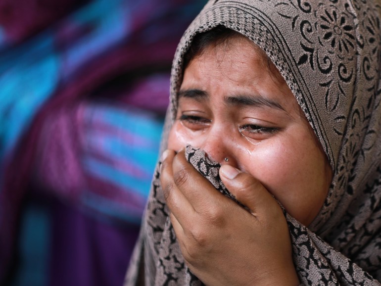Rukhsar, a Muslim woman who fled her home along with her family following Hindu-Muslim clashes triggered by a new citizenship law, reacts as she takes shelter in a relief camp in Mustafabad in the riot-affected northeast of New Delhi, India, March 3, 2020. Picture taken March 3, 2020. REUTERS/Anushree Fadnavis