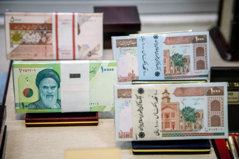 Iranian currency is displayed at an exchange shop in Tehran
