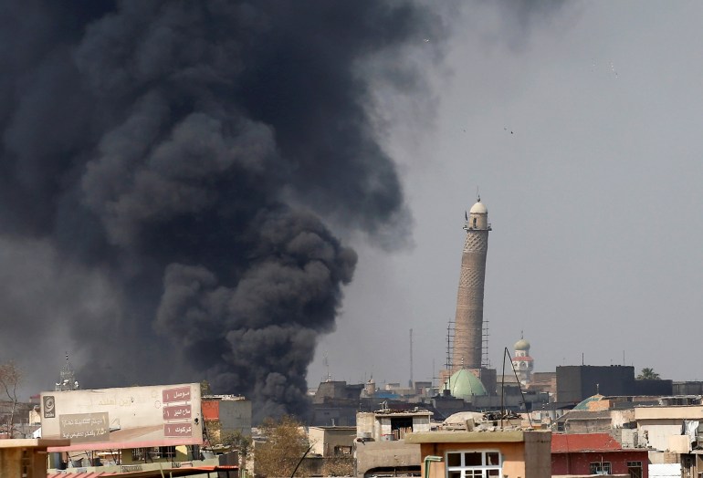 Smoke rises from clashes near Mosul's Al-Habda minaret at the Grand Mosque, where Islamic State leader Abu Bakr al-Baghdadi declared his caliphate back in 2014, as Iraqi forces battle to drive out Islamic state militants from the western part of Mosul