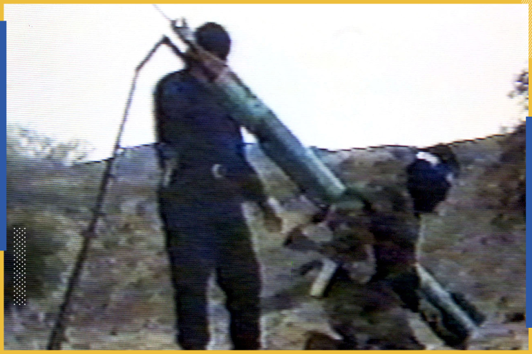 - UNDATED VIDEO - A picture taken from an undated video which was handed out by the militant Islamic group Hamas to news organisations in Gaza City February 16, 2002 shows Hamas members as they prepare to fire a Qassam-2 rocket. [Palestinians fired a Qassam-2 rocket into an Israeli community close to Palestinian-ruled Gaza Saturday, in the second use of the upgraded weapon in a week, the Israeli army said. The attack on Kfar Aza, north of Gaza, raised the specter of further retaliation from Israel, which launched a series of strikes in response to the first Qassam-2 attacks by Palestinian militants against an Israeli community] ? QUALITY DOCUMENT