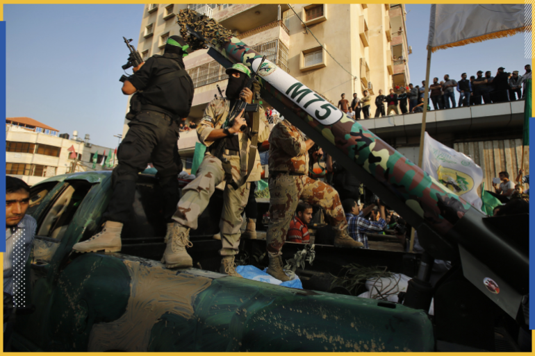 Palestinian Hamas militants stand next to M-75 home made rocket as they take part in a military parade marking the first anniversary of the eight-day conflict with Israel, in Gaza City November 14, 2013. Eight days of Israeli air strikes on Gaza and cross-border Palestinian rocket attacks in November last year ended in an Egyptian-brokered truce agreement calling on Israel to ease restrictions on the territory. REUTERS/Suhaib Salem (GAZA - Tags: POLITICS ANNIVERSARY CONFLICT MILITARY)