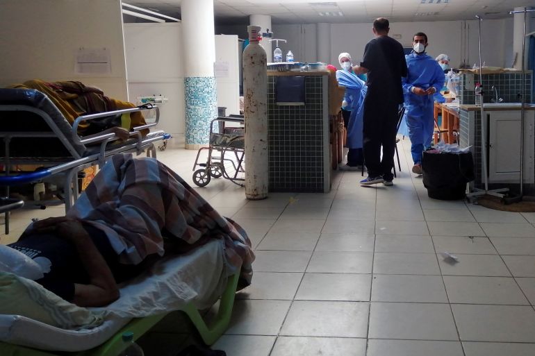 COVID-19 patients receive treatment at Charles Nicole Hospital in Tunis