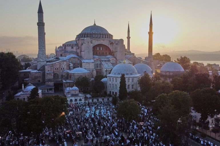 People pray on the first day of Muslim holiday of Eid al-Adha outside the Ayasofya-i Kebir Camii or Hagia Sophia Grand Mosque in Istanbul, Turkey July 9, 2022. REUTERS/Murad Sezer