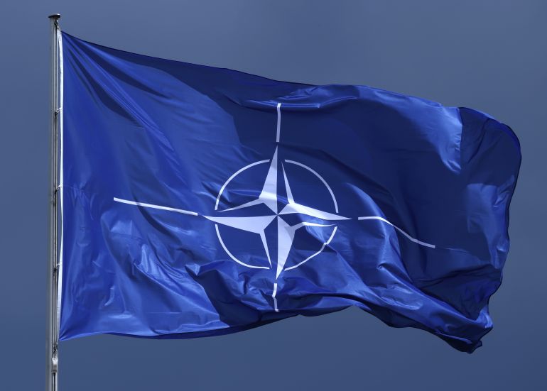 BERLIN, GERMANY - JULY 09: The NATO flag flies prior to a meeting between German Chancellor Friedrich Merz and NATO Secretary General Mark Rutte at the Chancellery on July 09, 2025 in Berlin, Germany. Rutte recently warned of imperialist ambitions by both Russia and China that could spark a third world war. (Photo by Sean Gallup/Getty Images)