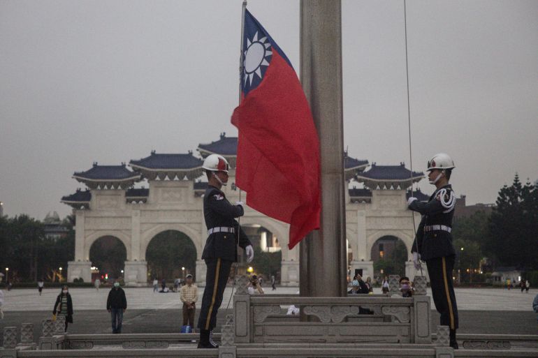 TAIPEI, TAIWAN - APRIL 06: Members of Taiwans military police take part in a flag lowering ceremony at Freedom Square on April 6, 2023 in Taipei, Taiwan. Taiwan's President Tsai Ing-wen visited the U.S. and met with lawmakers, as President Biden urged China not to overreact during the visit. (Photo by Chris McGrath/Getty Images)