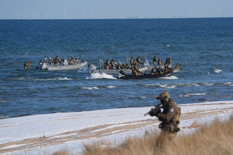 dpatop - 18 February 2026, Schleswig-Holstein, Putlos: Soldiers go ashore during the NATO maneuver Steadfast Dart at the military training area on the Baltic Sea coast. With the large-scale maneuver Steadfast Dart, NATO partners want to prepare for possible future threats in the Baltic Sea. The large-scale maneuver is being carried out by NATO's Allied Reaction Force (ARF), a rapid reaction force of around 40,000 soldiers that is constantly on standby. Photo: Marcus Brandt/dpa (Photo by Marcus Brandt/picture alliance via Getty Images)