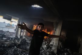 GAZA CITY, GAZA - SEPTEMBER 8: A Palestinian boy reacts to a damaged building with smoke visible inside after an Israeli airstrike on September 8, 2026 in western Gaza City. According to the latest figures from Hamas-run Ministry of Health, more than 900 people have been killed in Israeli attacks in Gaza this year despite a ceasefire being in place. It brings the total number of Palestinians killed in the Strip since the 10 October ceasefire was declared to more than 1,300. (Photo by Omar Ashtawy/Getty Images)