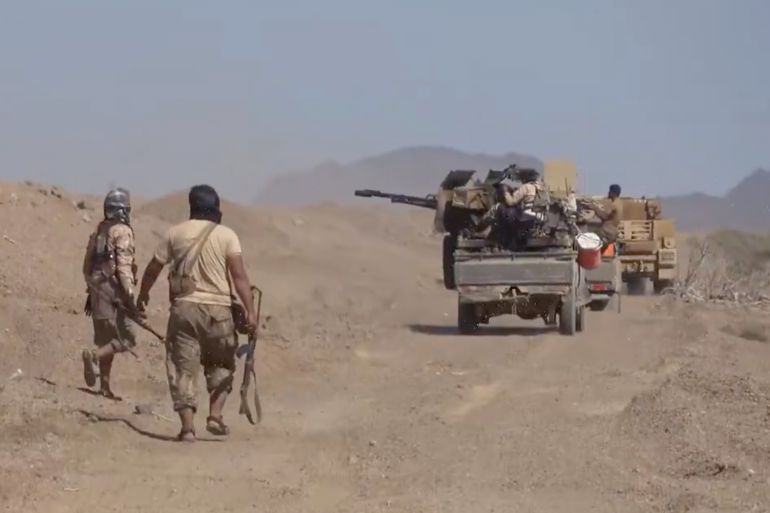 This image taken from undated video released Monday, Oct. 5, 2026, by the Yemeni government-allied Southern Giants Brigades media office shows, what the group says, are its fighters advancing with a pickup truck mounted with a heavy weapon during clashes with the Iran-backed Houthi group in Dhobab district, Taiz, Yemen. (Southern Giants Brigades Media Office via AP)